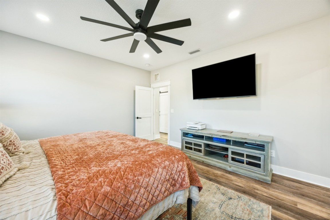 32500 Crossfire Trail Callahan, FL 32011 - Photo 26 of 64 a bedroom with a bed and a flat screen tv