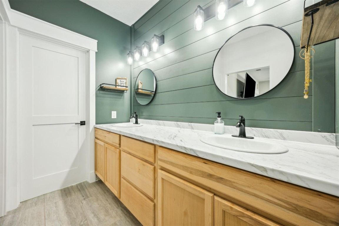 32500 Crossfire Trail Callahan, FL 32011 - Photo 27 of 64 a bathroom with a double vanity sink and a mirror