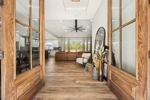 a large kitchen with a table and chairs