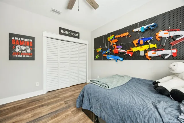 a bedroom with bed and a window