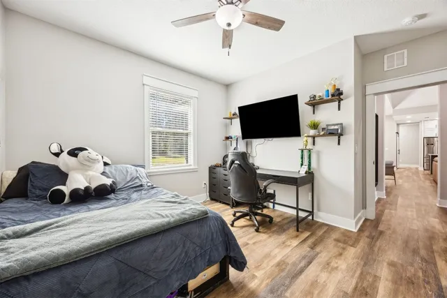 a view of a patio with table and chairs and potted plants