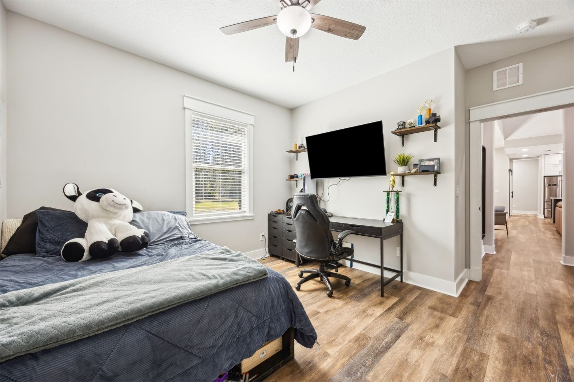 32500 Crossfire Trail Callahan, FL 32011 - Photo 36 of 64 a bedroom with a bed and a flat screen tv