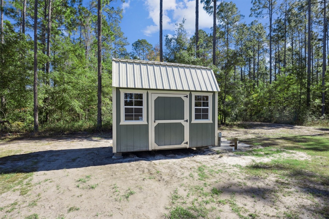 32500 Crossfire Trail Callahan, FL 32011 - Photo 42 of 64 a view of a house with backyard and sitting area