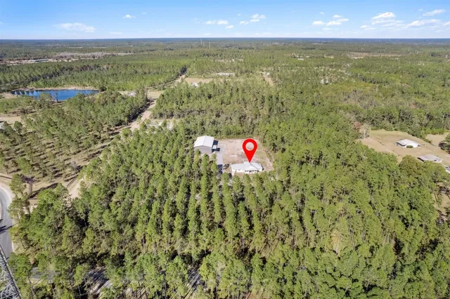 a view of yard with swimming pool and green space