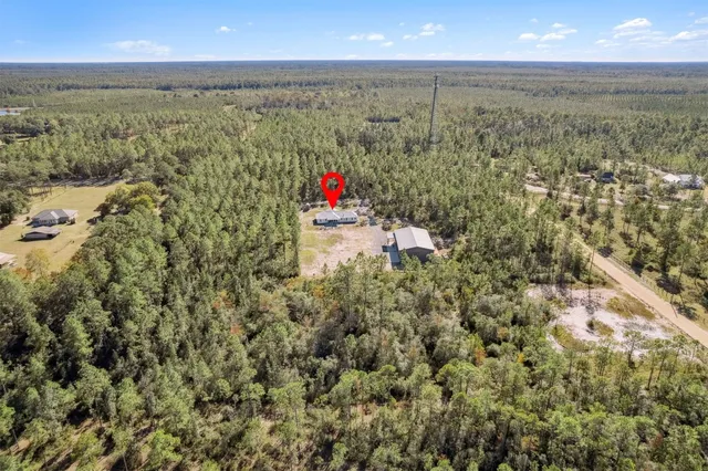 a large room with furniture and large windows