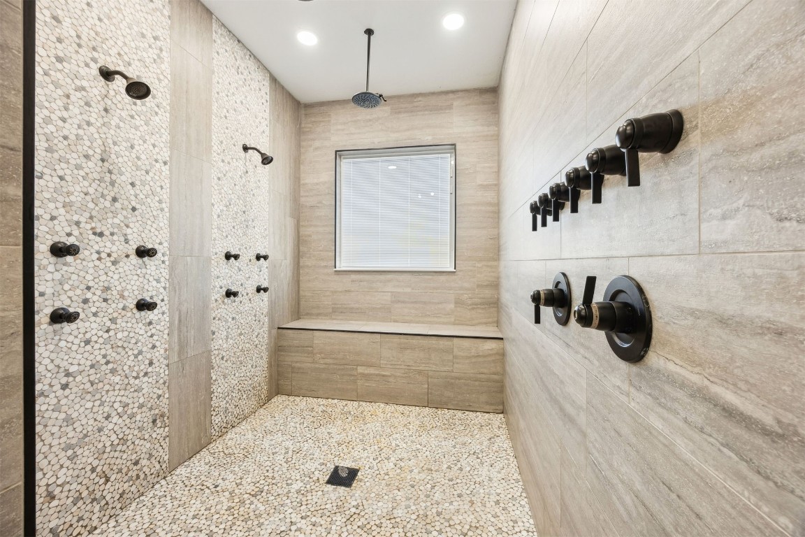 32500 Crossfire Trail Callahan, FL 32011 - Photo 5 of 64 a bathroom with a bathtub and a shower