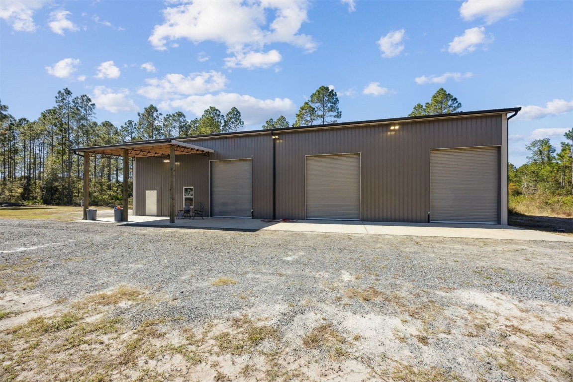32500 Crossfire Trail Callahan, FL 32011 - Photo 56 of 64 a view of a house with a yard and potted plants