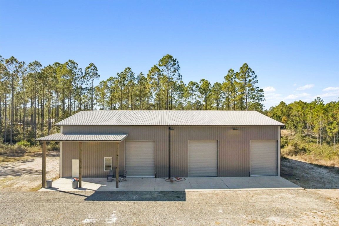 32500 Crossfire Trail Callahan, FL 32011 - Photo 6 of 64 a view of a house with a yard and garage