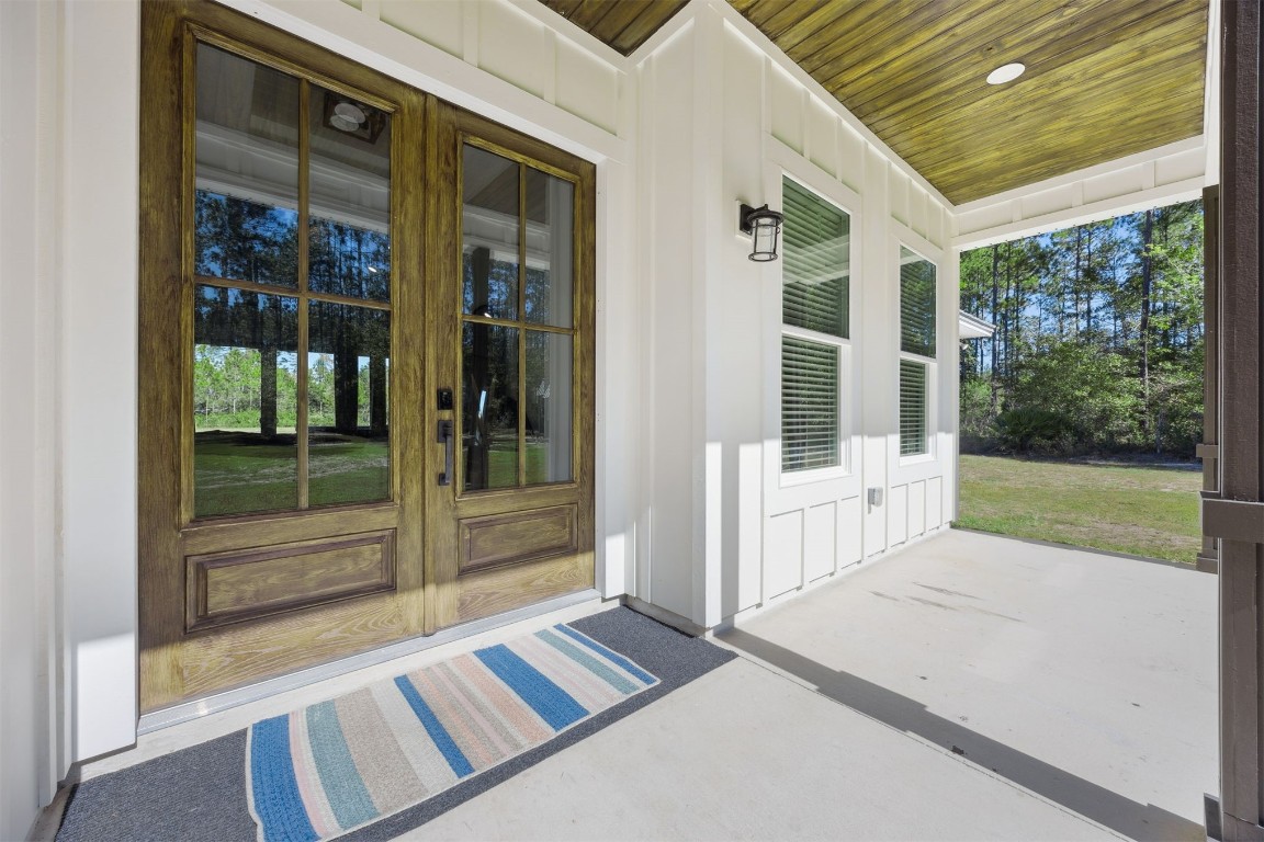 32500 Crossfire Trail Callahan, FL 32011 - Photo 8 of 64 a view of porch with a black and white chair