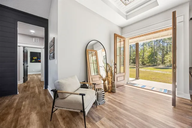 a living room with furniture and a large window