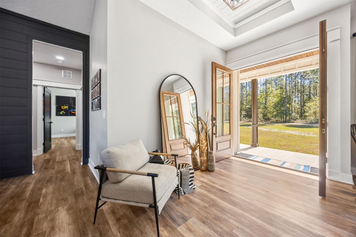 32500 Crossfire Trail Callahan, FL 32011 - Photo 10 of 64 a living room with furniture and a large window with wooden floor