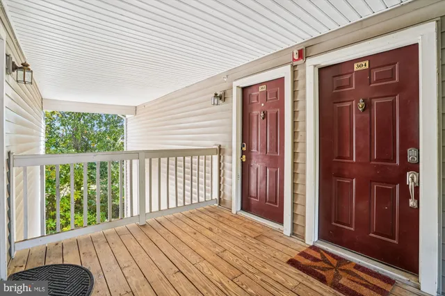 a view of a balcony with wooden floor