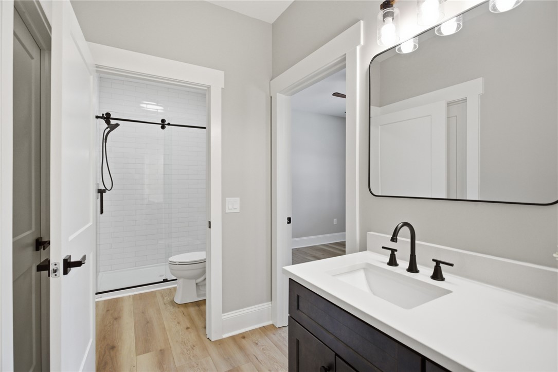 147 McAlister Road West Union, SC 29696 - Photo 21 of 49 This modern bathroom features a sleek vanity and a spacious shower, ideal for daily routines.