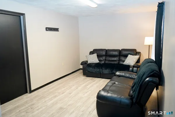 a room with wooden floor and furniture