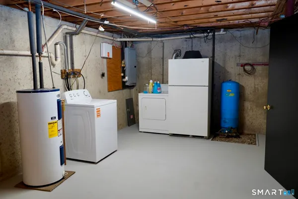 a view of a patio with table and chairs with wooden floor and fence