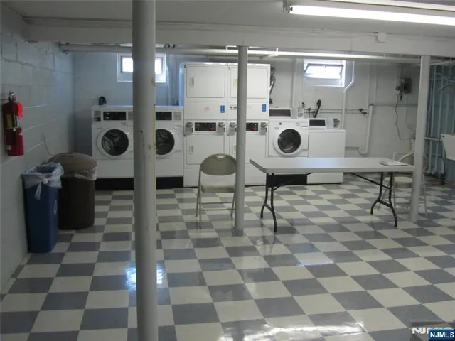 a view of a entryway with furniture and chandelier