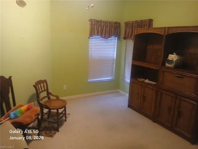 a bedroom with a bed and chair
