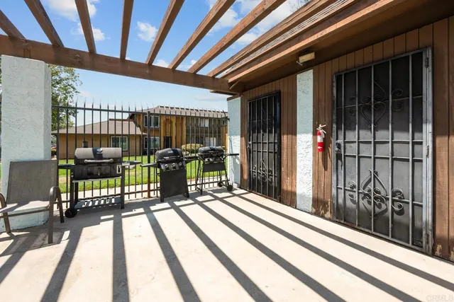 a front view of a house with yard and outdoor seating