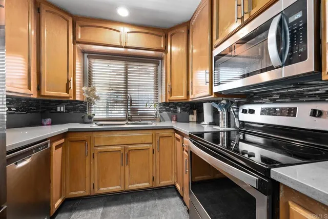 a kitchen with a stove and a sink