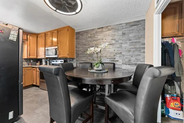 a view of a dining room with furniture and window