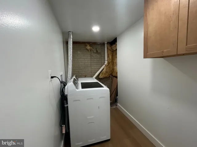 a view of storage and utility room with washer and dryer