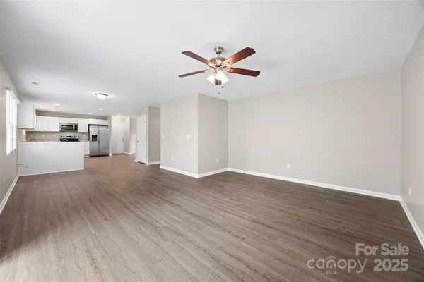 a view of a kitchen with a dishwasher cabinets and wooden floor