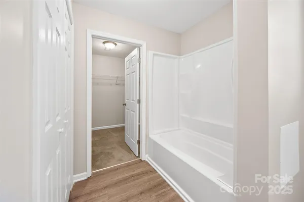 a bathroom with a bathtub and shower