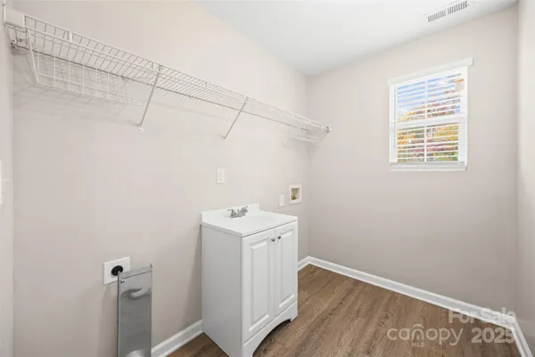 a view of a storage & utility room with a window