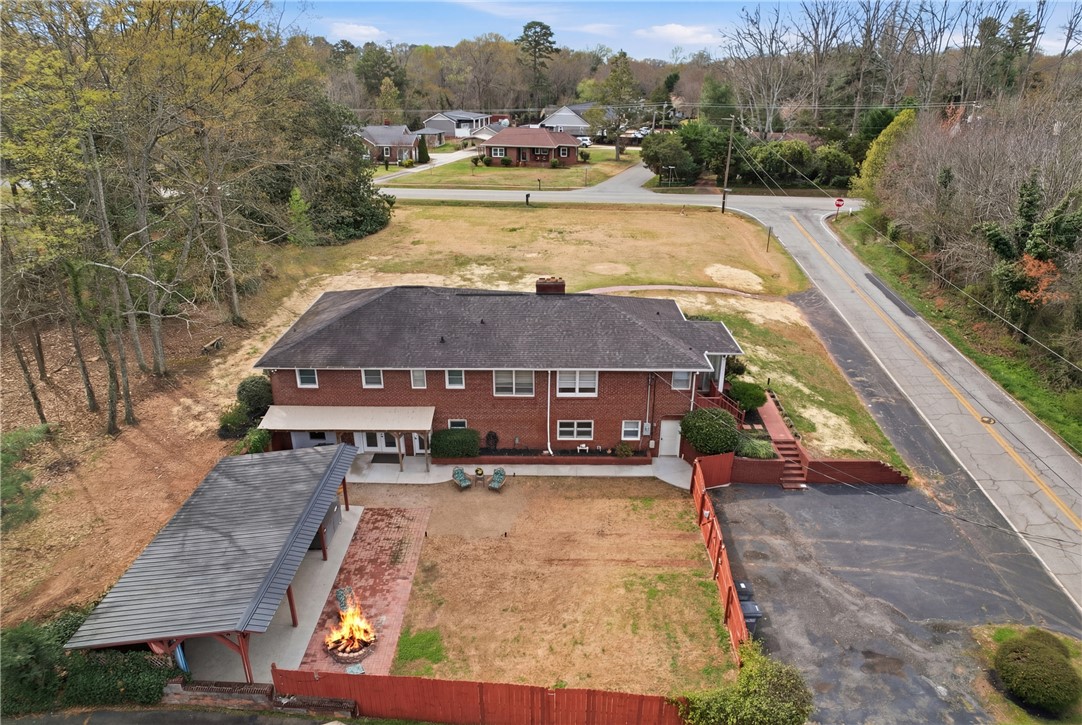 4304 Old Buncombe Road Greenville, SC 29617 - Photo 44 of 49 This expansive brick residence offers ample outdoor living space and convenient paved parking.