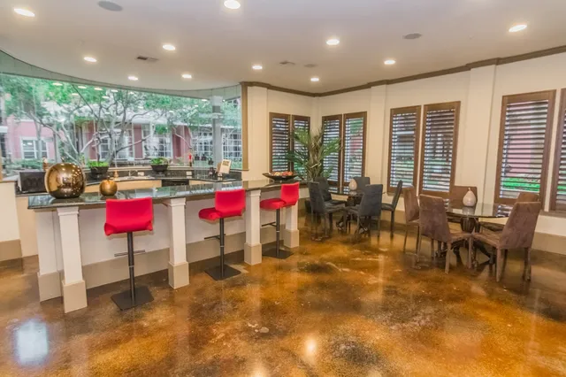 a view of play room with windows and tables