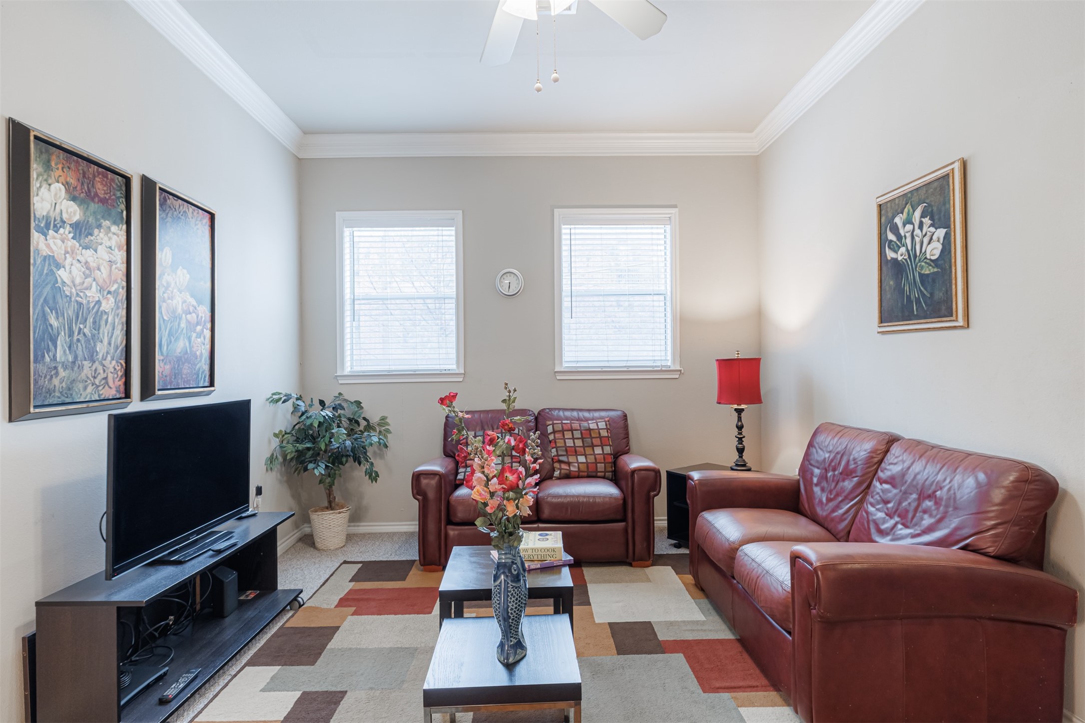 2400 McCue Road, Unit 202 Houston, TX 77056 - Photo 3 of 24 a living room with furniture a flat screen tv and a window