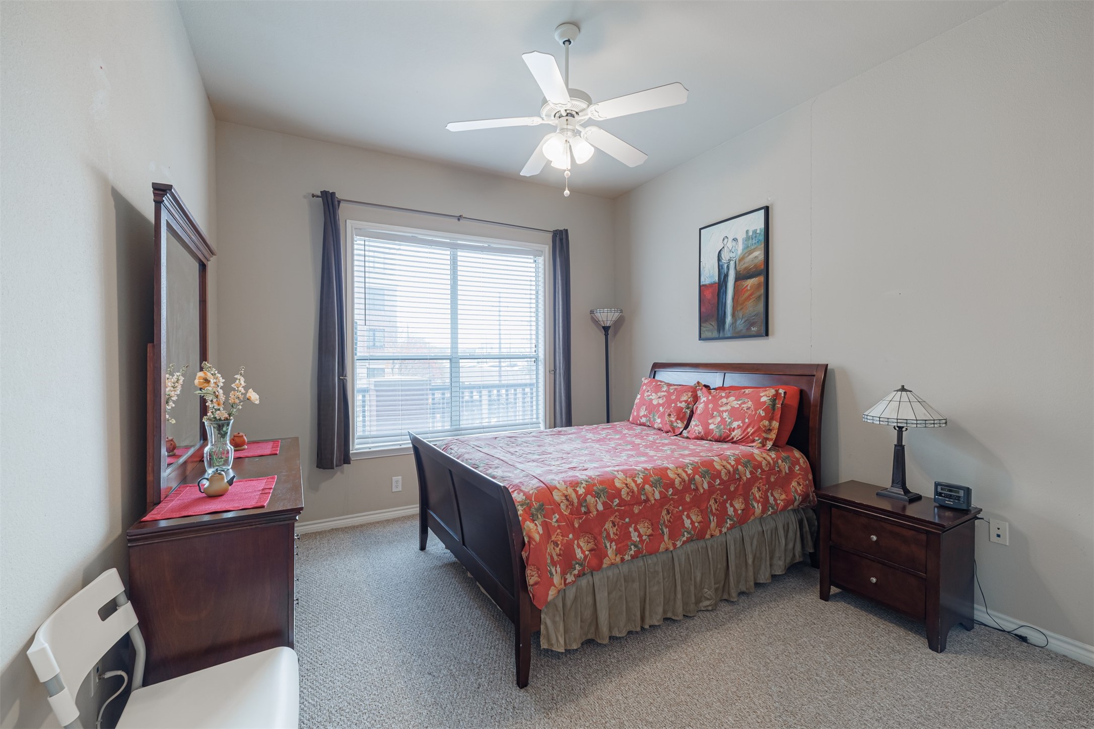 2400 McCue Road, Unit 202 Houston, TX 77056 - Photo 7 of 24 a bedroom with a bed and a chandelier