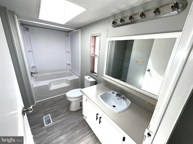 a bathroom with a tub and shower