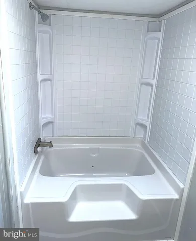 an empty room with a empty space and a window