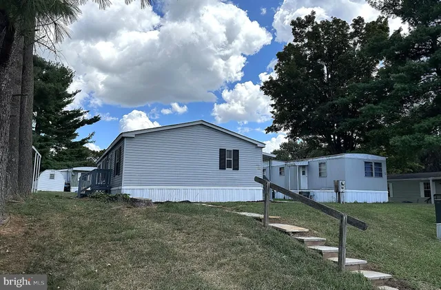 a view of a swimming pool with an outdoor seating