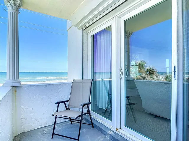 a room with furniture and potted plant