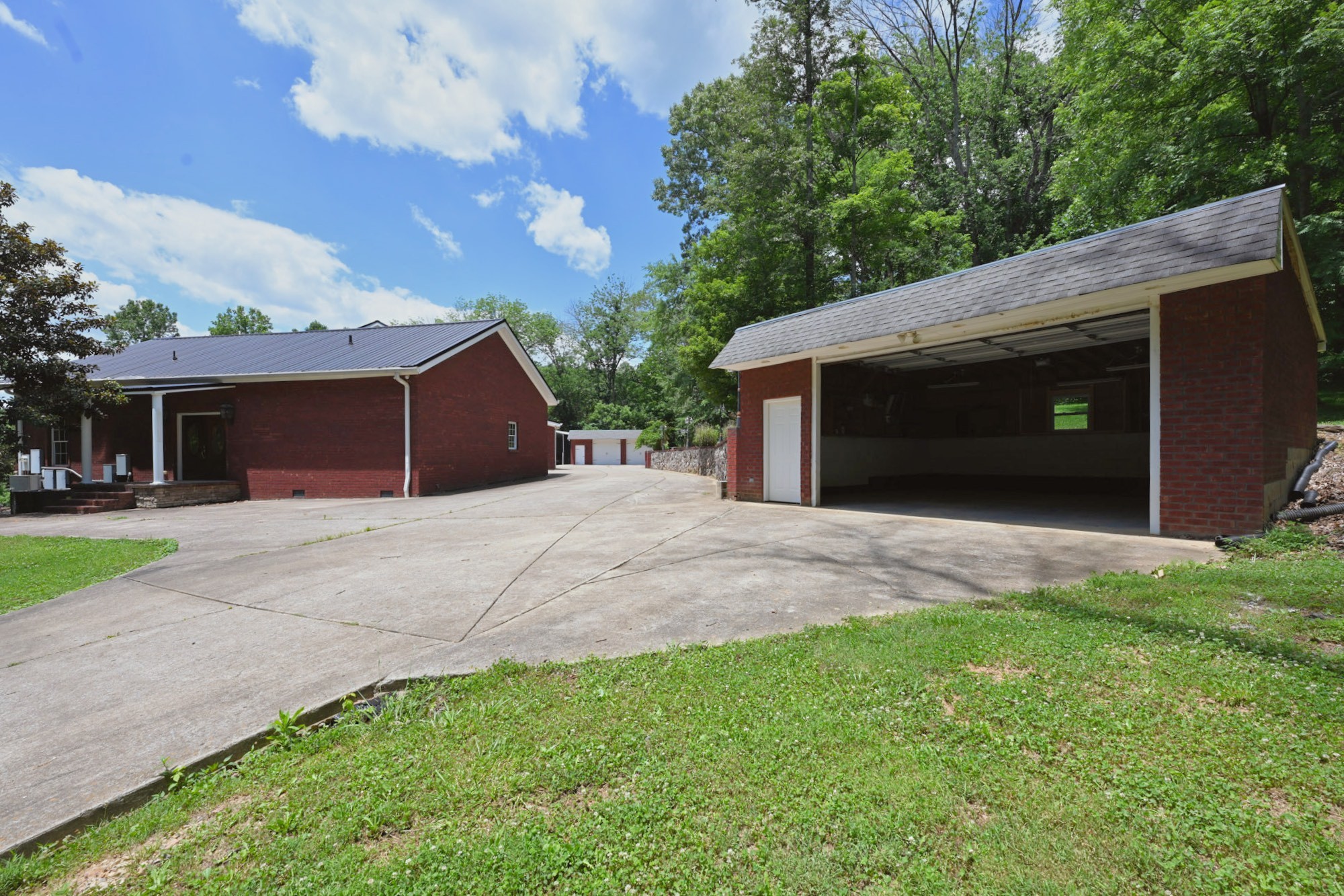 125 Happy Hollow Road Goodlettsville, TN 37072 - Photo 72 of 92 a front view of a house with a yard and garage