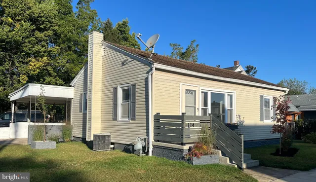 a view of a house with a backyard porch and sitting area
