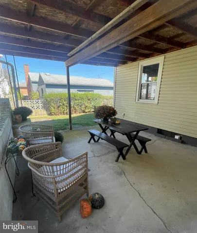 a room with furniture and a large window