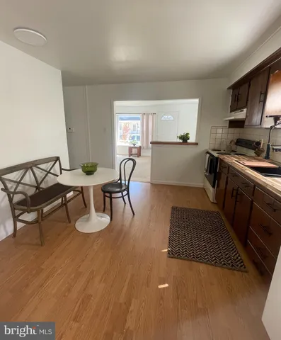 a kitchen with sink and cabinets