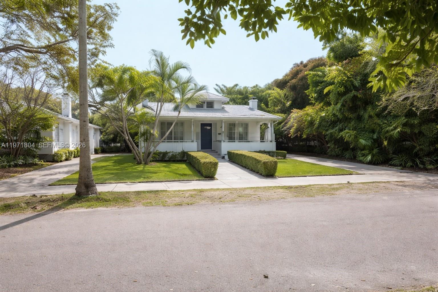 640 Northeast 71st Street Miami, FL 33138 - Photo 1 of 14 a view of a house with a swimming pool