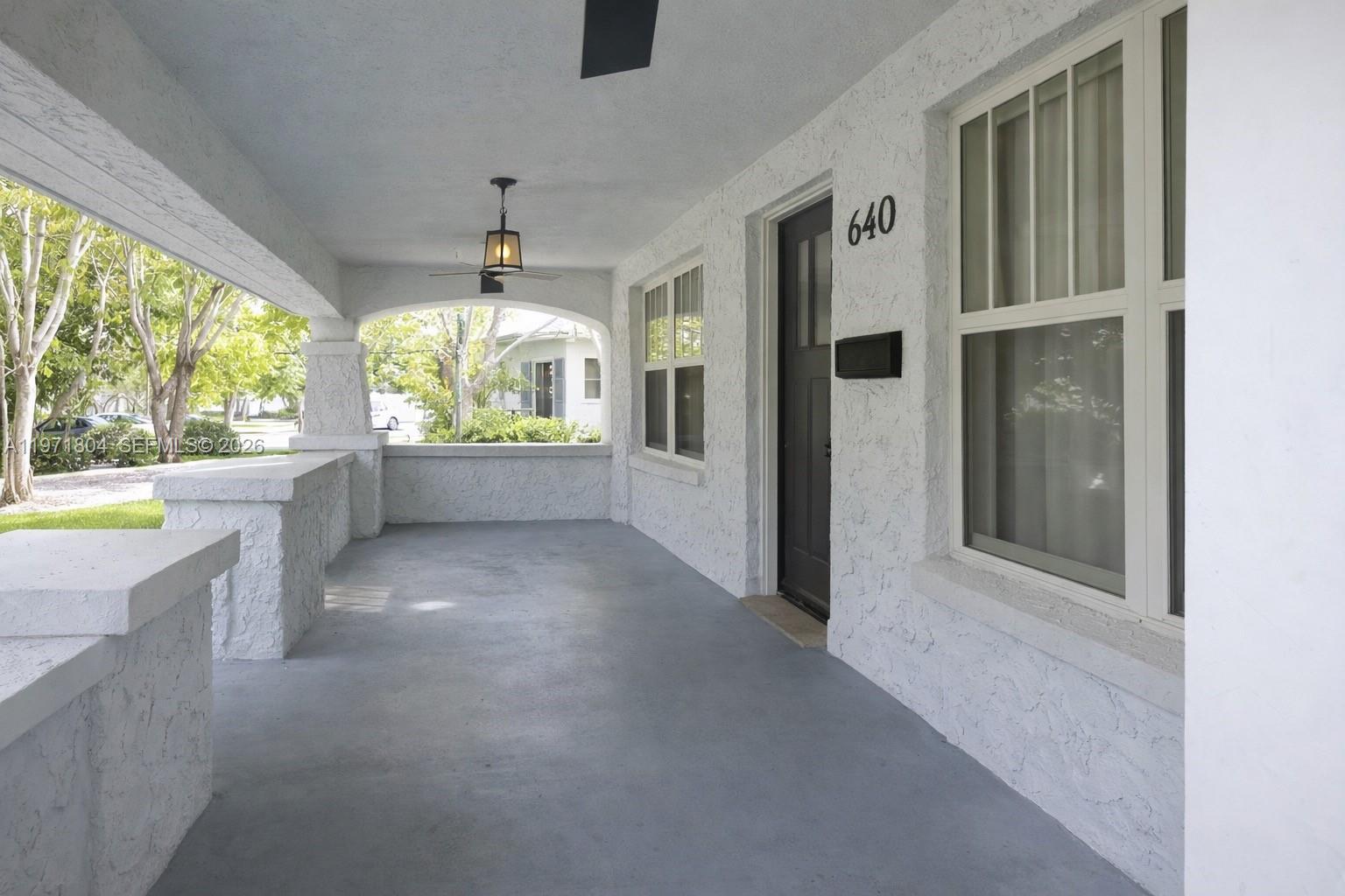 640 Northeast 71st Street Miami, FL 33138 - Photo 2 of 14 an empty room with windows