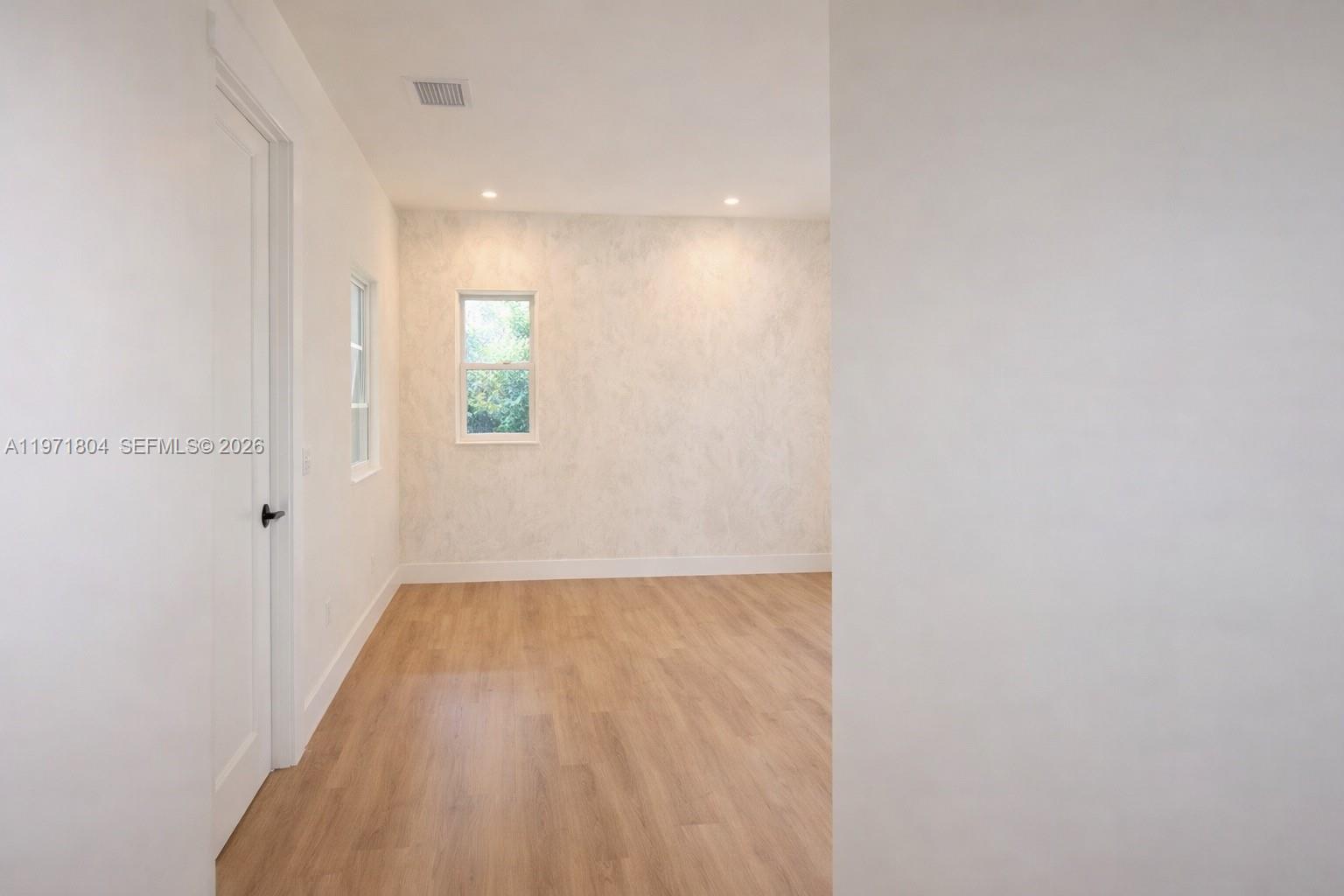 640 Northeast 71st Street Miami, FL 33138 - Photo 10 of 14 a view of an empty room and window