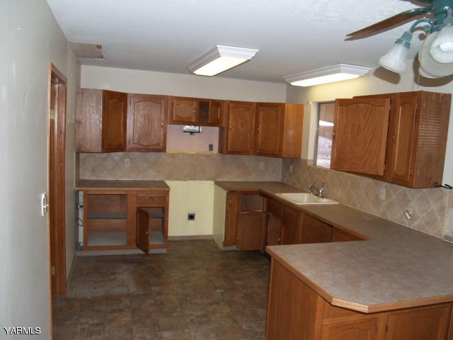 721 Bittner Road Yakima, WA 98901 - Photo 8 of 18 a kitchen with a stove and a sink