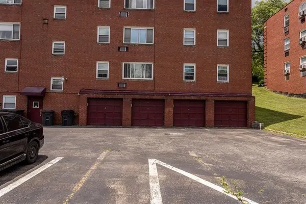 a view of a building with a yard