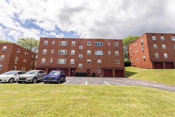 a view of a car parked in front of a building