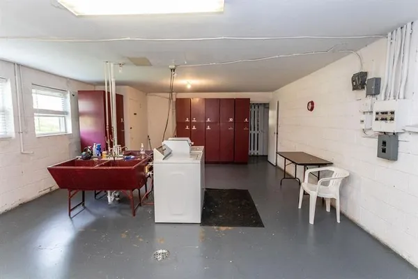 a view of a dining room with furniture and chandelier
