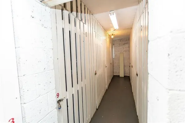 a view of an empty room and wooden floor