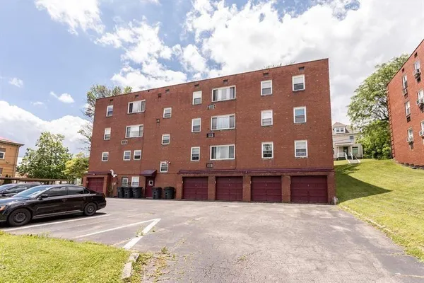 a view of a building with a yard