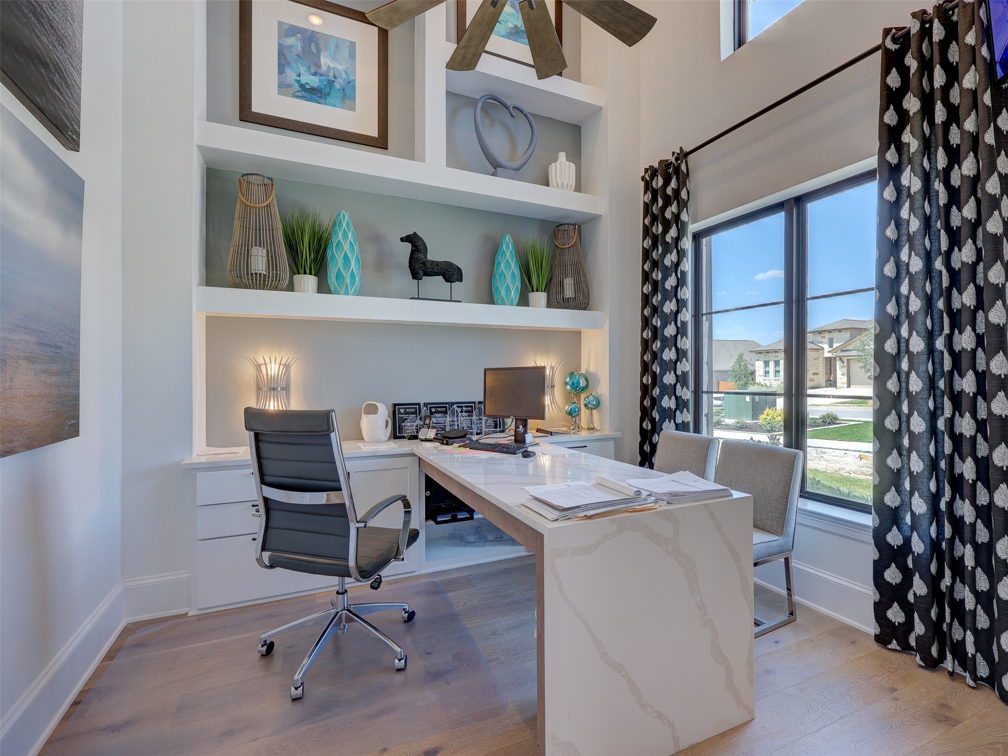 6220 Bower Well Road Austin, TX 78738 - Photo 3 of 28 An airy office space with built-in shelving offers an inspiring view of the neighborhood.